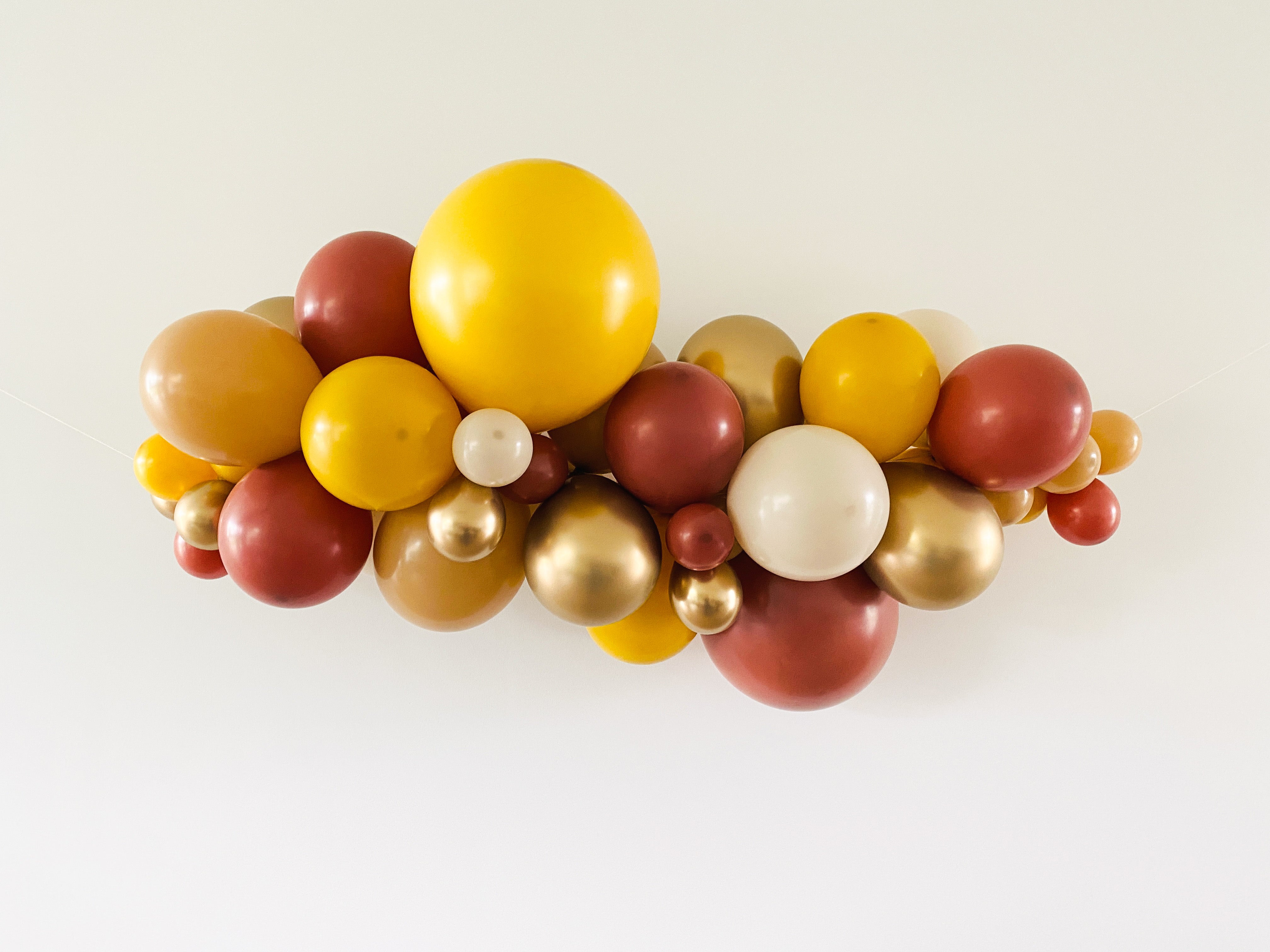 Ballonslinger ballonnenboog balloongarland Mustard Terracotta.jpg