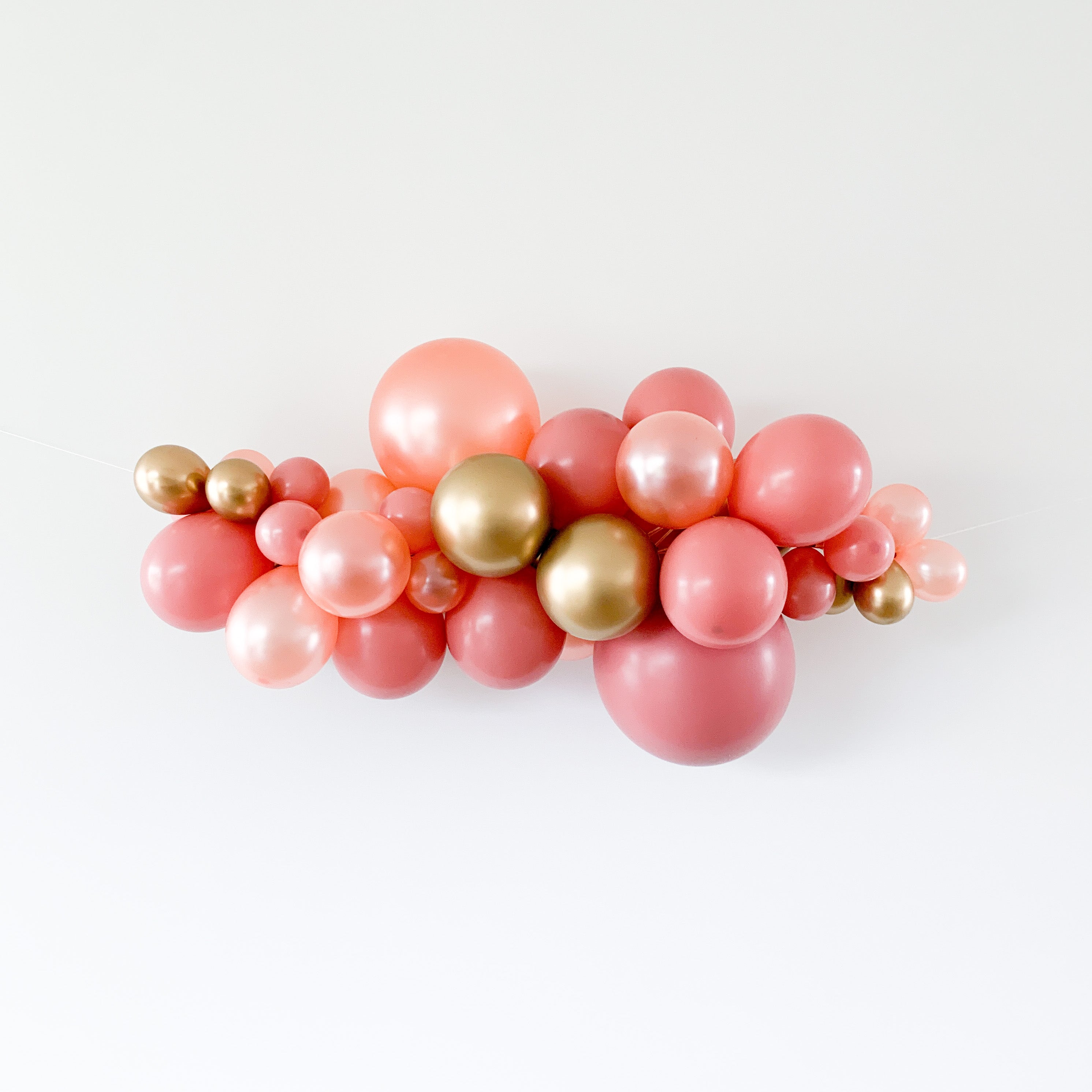 Ballonslinger ballonnenboog roze goud rosé brons als feestdecoratie