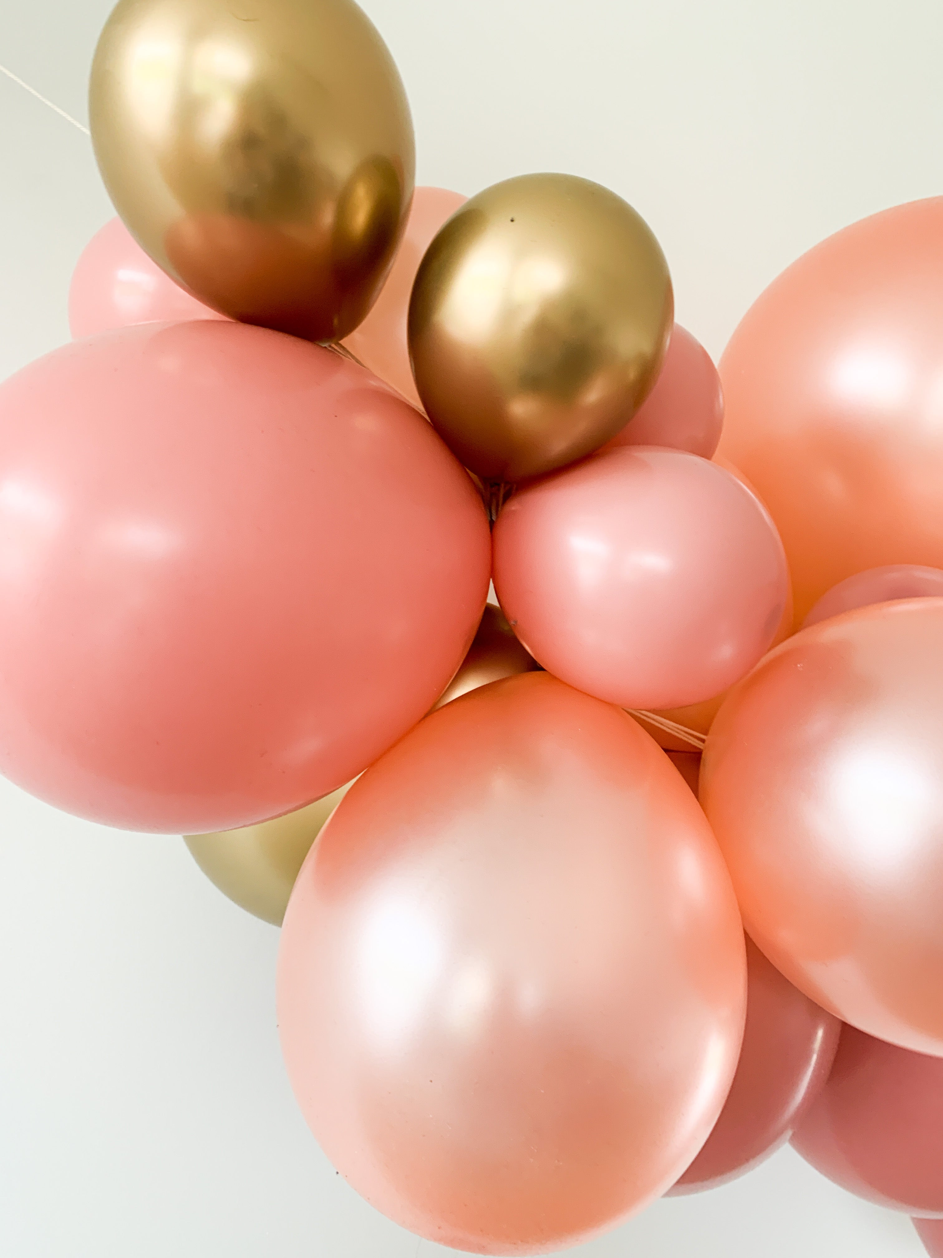 Ballonslinger ballonnenboog roze goud rosé brons als feestdecoratie